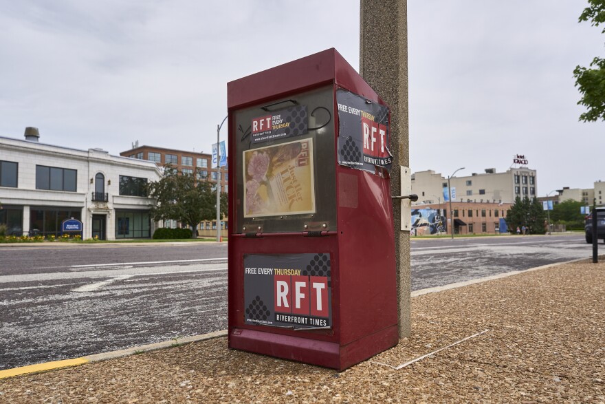 A red Riverfront Times newsstand