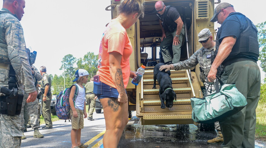 U.S. Air Force Security Forces Airmen assigned to the South Carolina Air National Guard, 169th Fighter Wing, assist Florence County, S.C., Sheriff's Department with evacuation efforts in Florence, S.C., Sept. 17, 2018. 
