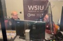 WSIU's Brad Palmer and Blair Allen from NASA EDGE sitting in front of microphones in the WSIU studio discussing the upcoming total solar eclipse experience in Carbondale.