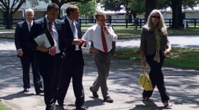 Senator Rand Paul walks and talks with aids after a speech to the Rotary Club of Lexington.