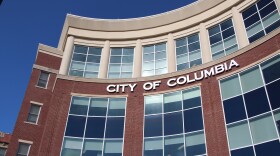 The Columbia red brick government building affixed with letters spelling out "City of Columbia."