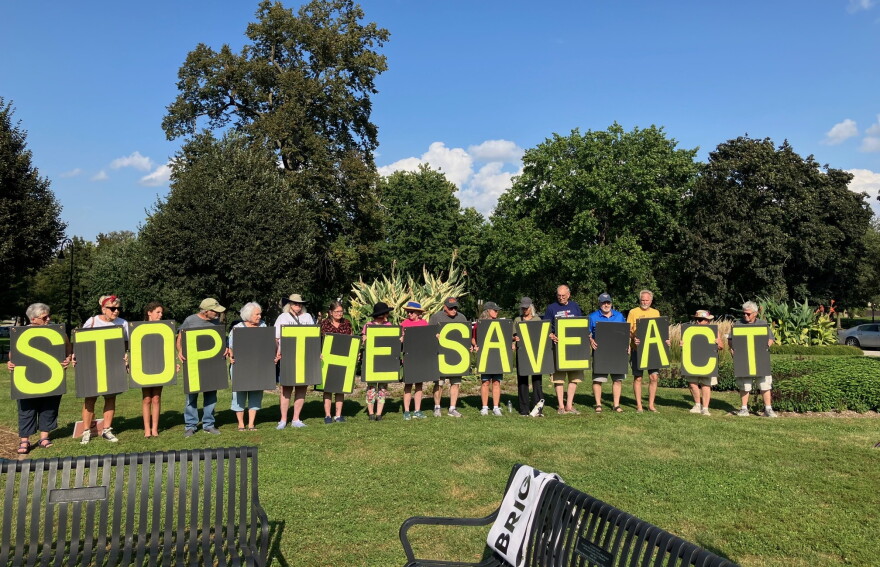 Protestors at the Women's Equality Day rally at Vander Veer Park, Wednesday, Aug. 26, 2026.
