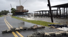 A block wall, knocked over from storm surge 