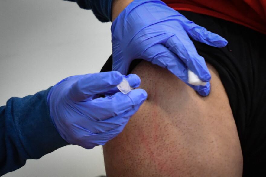 A Kansas City resident receives his first shot of the Pfizer BioNTech COVID-19 vaccination on Jan. 26 at Morning Star Missionary Baptist Church.