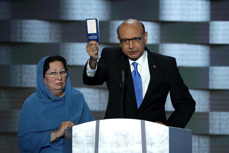 Khizr Khan, father of deceased soldier Humayun S.M. Khan, holds up a copy of the U.S. Constitution as he delivers remarks on the final day of the convention.