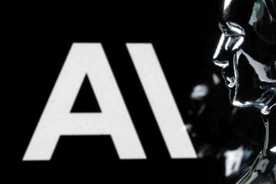 This photograph shows a figurine in front of the logo of the US artificial intelligence safety and research company Anthropic during a photo session in Paris on February 13, 2026. (Joel Saget / AFP via Getty Images)