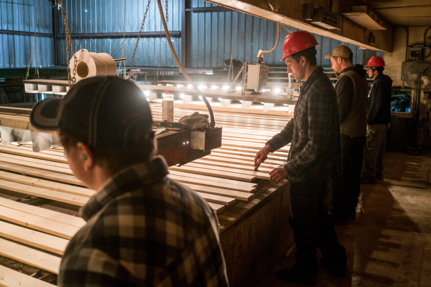 Workers on the line at Pyramid Mountain Lumber Company