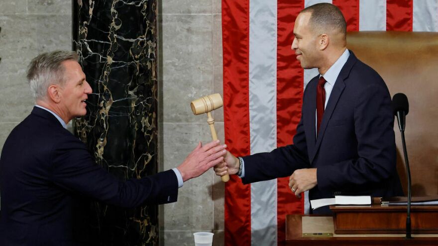Speaker of the House Kevin McCarthy, R-Calif., receives the gavel from House Democratic leader Hakeem Jeffries, D-N.Y., after McCarthy was elected speaker in the House Chamber at the U.S. Capitol early Saturday morning.
