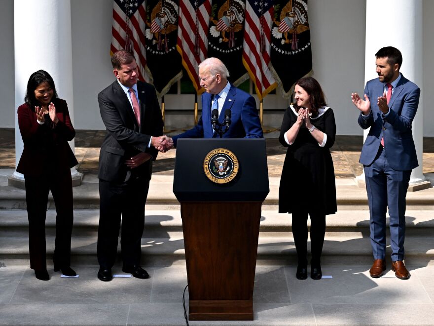 President Joe Biden shakes hands with U.S. Secretary of Labor Marty Walsh on September 15, 2022, after speaking about the railway labor agreement brokered by the White House. The deal has been ratified by nine of 12 rail unions.