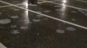 A Tulsa parking lot is a solid sheet of ice.