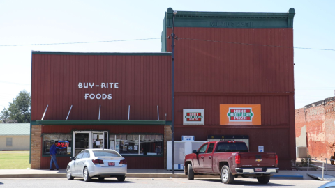 Buy-Rite Foods is a red building situated in the middle of Pond Creek, Oklahoma. Inside, shoppers will see whirring refrigerators, rows of food and a hot food counter in the back.