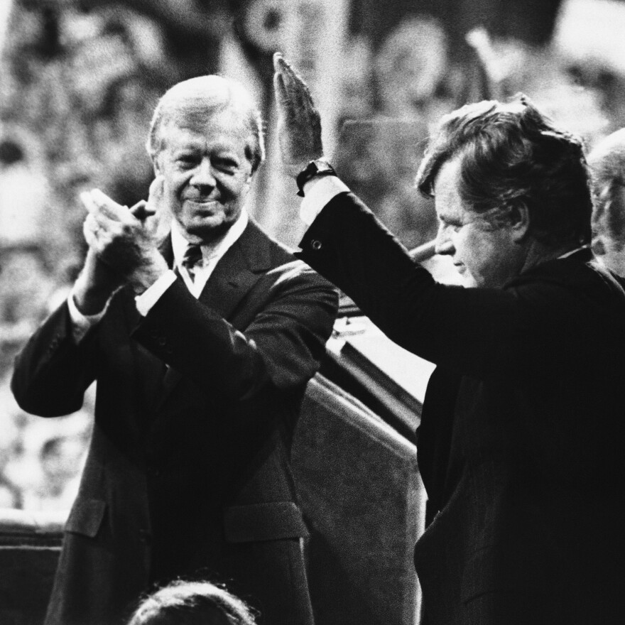President Jimmy Carter applauds as Sen. Edward Kennedy waves to cheering Democratic National Convention delegates in New York's Madison Square Garden, Aug. 14, 1980. Kennedy's vigorous primary challenge contributed to Carter's eventual loss to Ronald Reagan that fall.