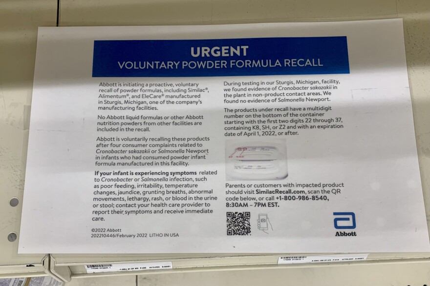 At Weis Markets, a baby formula recall announcement from Abbott is taped to an empty shelf. The recall has contributed to the national baby formula shortage.