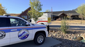 First responder vehicles parked outside a building