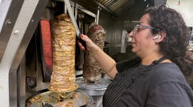 Reem Hadir, Executive Chef and founder of Lebnani Mediterranean Kitchen and Bar slicing chicken shawarma in Watertown, Connecticut.