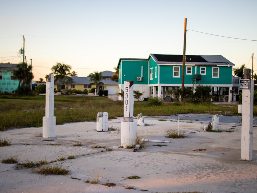 The remnants of a home in Fort Myers Beach, Fla. High rebuilding and insurance costs have driven away longtime homeowners. "When you think about what was here and the sort of cool, old wood-framed beach cottages and stuff like that, those are all going to end up being rebuilt with new, very resilient structures. But they're going to be much more expensive," says Shelton Weeks, director of the Lucas Institute for Real Estate Development & Finance at Florida Gulf Coast University. "And, as a result, you're going to have folks come in that can afford that, the incomes are going to be higher, and some folks are going to be displaced."