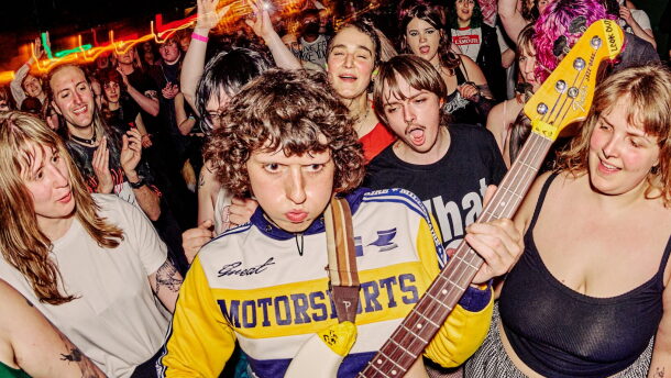 Issley Manzi plays a guitar at a previous Queercore fest