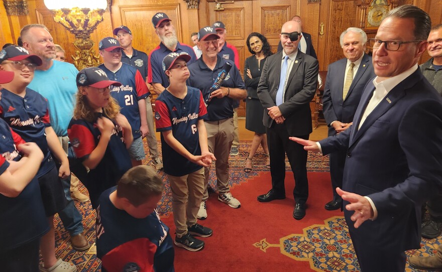 Gov. Josh Shapiro speaks to members of the Wyoming Valley Challenger baseball team.
