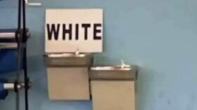 A sign left atop a water fountain at Piedmont High School.