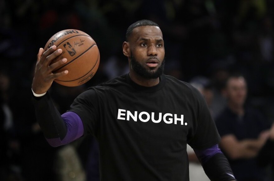 Los Angeles Lakers' LeBron James wears a t-shirt for the 12 victims of Wednesday night's shooting at a bar in Thousand Oaks, Calif., before an NBA basketball game against the Atlanta Hawks. His new docuseries 'Shut Up and Dribble' is on Showtime.