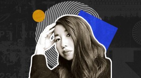 Muriel Leung sits with her head resting on her hand, in front of colorful cutouts