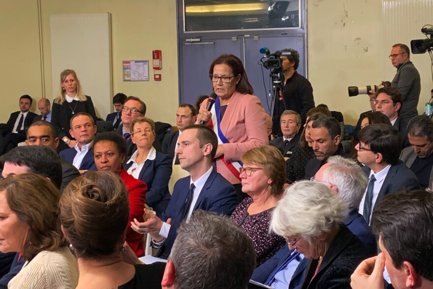 Meriem Derkaoui, the mayor of Aubervilliers, a suburb north of Paris, speaks at Monday's meeting with President Emmanuel Macron. During the meeting, she expressed frustration with delays in a Paris metro extension to her town.