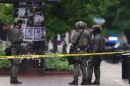 Law enforcement officials investigate after an attack on the Pearl Street Mall, Sunday, June 1, 2025, in Boulder, Colo.
