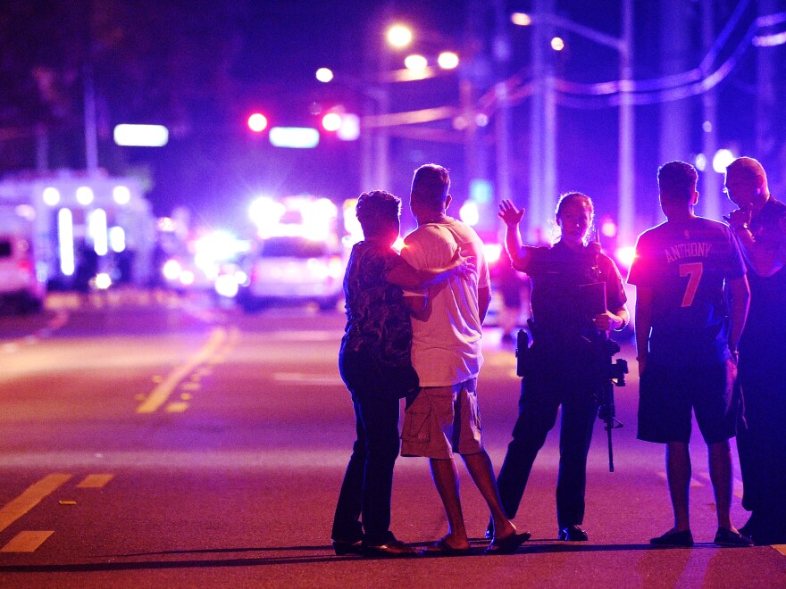 Orlando Police officers direct family members away from a fatal shooting at Pulse nightclub in Orlando, Fla. An investigation has found that a fire department plan to respond to mass shootings had been put on hold.