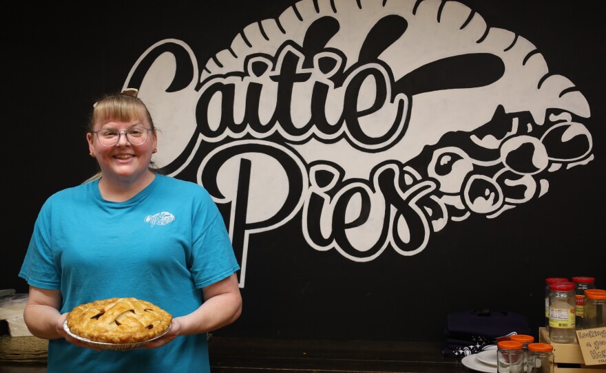 Caitlyn Wallace owner of Caity Pies with her fresh apple pie. Photo by Allison Diaz.