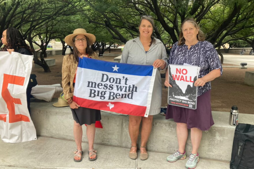 People opposed to a border wall in Big Bend gather outside the federal courthouse in El Paso before a legal hearing on Oct. 2.
