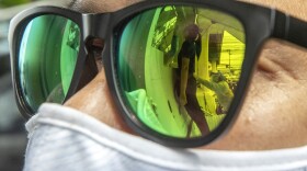 COVID-19 test reflected in sunglasses