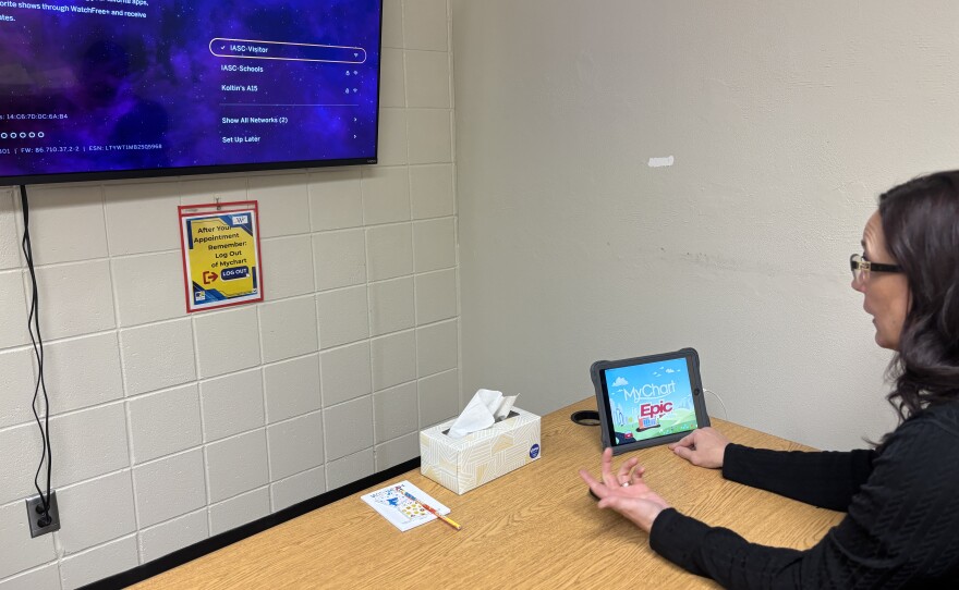 Project Manager Susan Nelson explains the Deer River High School's telehealth setup Dec. 4, 2025.