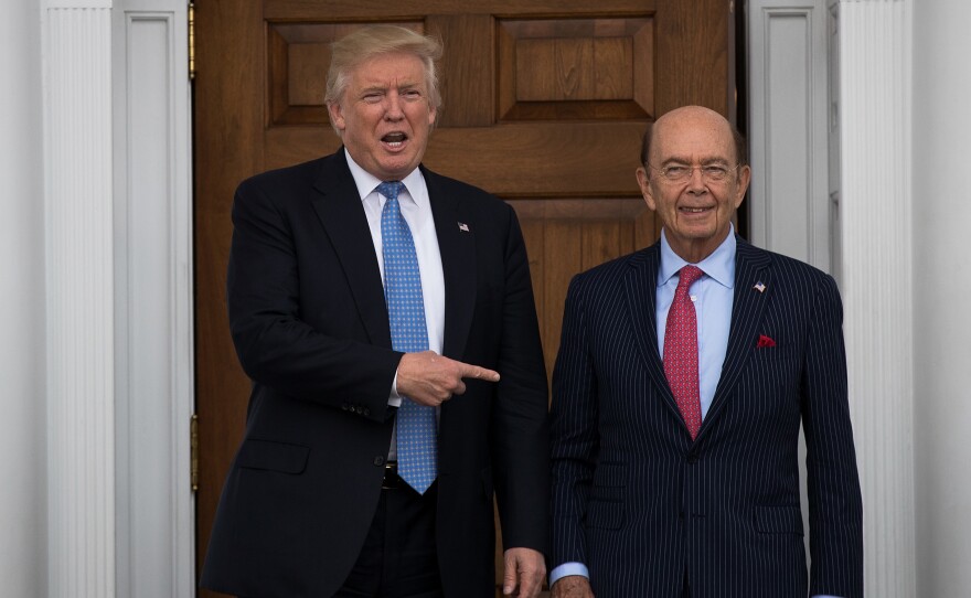 Shortly after winning the 2016 election, Donald Trump asked investor Ross to be his commerce secretary. The pair are pictured here at Trump's golf club in Bedminster, N.J., in November 2016.