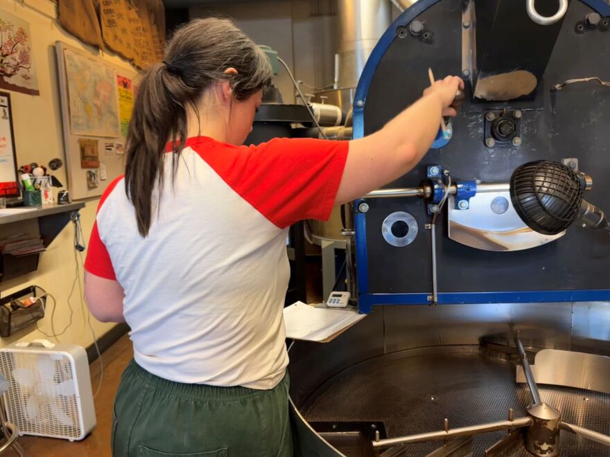 Ellen Collingwood monitors a large roasting machine at Broadway Roasting Company in Kansas City, Missouri. The beans roast for about 20 minutes. 