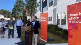 Tom Cruess at the podium from NeighborWorks New Horizons, which developed a new complex, Linden Place apartments with a majority of 44 low income apartments in Waterbury, Connecticut September 3, 2024.