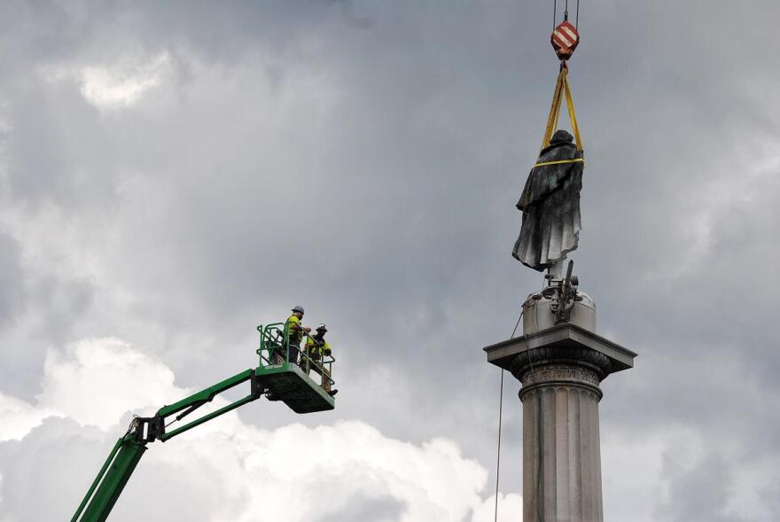 Crews worked for more than 17 hours to take down the statue of John C. Calhoun from its pedestal.  June 2021