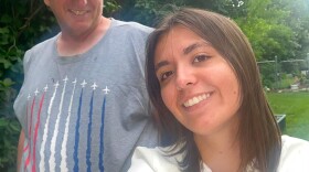 A selfie of two people outside, one a young woman and the other a man. 