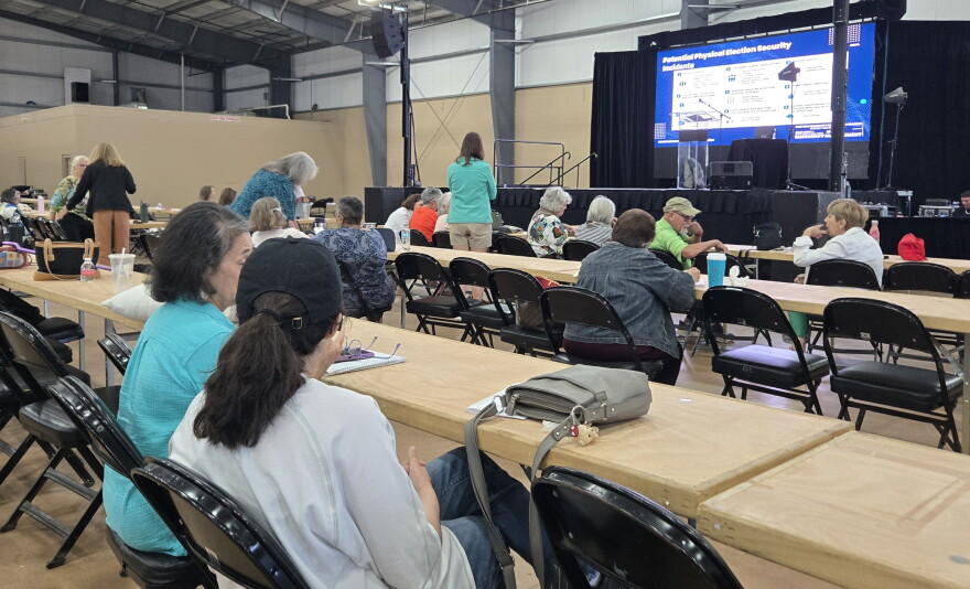 County election volunteers during a break in safety and security training at an expo hall on the rodeo grounds on Sept. 9, 2026