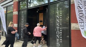 Customers walk into FlynnStoned Cannabis Company on June 15, 2023 for the soft opening of the business.