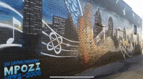 The original mural of Mpozi was unexpectedly painted over last year.