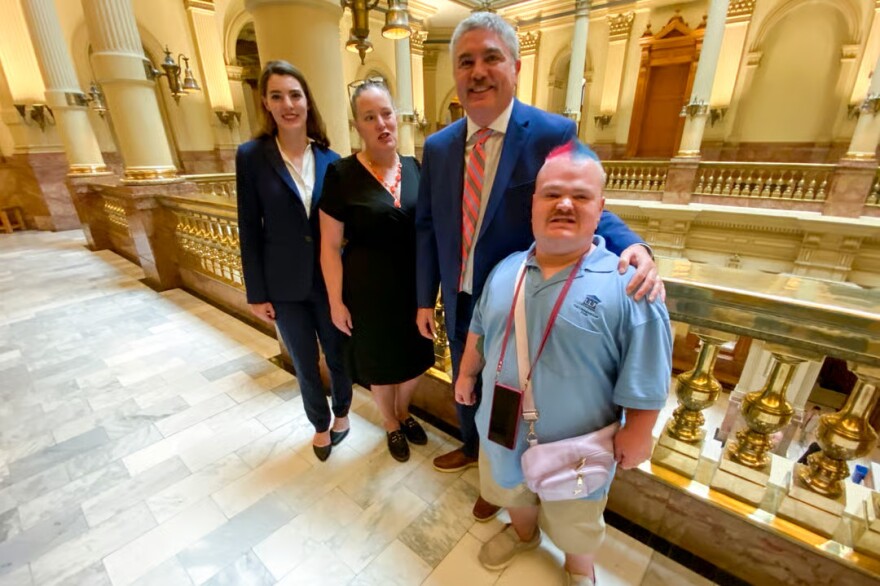 Bailey (from left), Michelle, Von and Andrew Limbaugh stand inside the Colorado State Capitol on July 6, 2026. Von said Andrew, who has intellectual and developmental disabilities, has "been receiving Medicaid supports and services pretty much his whole life."