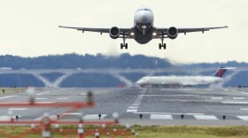 A U.S. Airways Airbus A320 airplane takes off from a runway at Ronald Reagan Washington National Airport in Arlington, Virginia, September 23, 2013. (Saul Loeb/AFP/Getty Images)