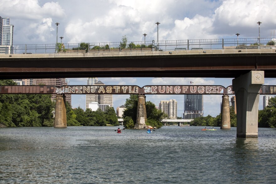 The words "I've Got Ninja Style and a Kung Fu Grip" across the train bridge.