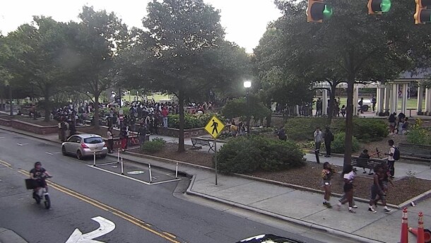 Large group of teenagers gathers in Romare Bearden Park.