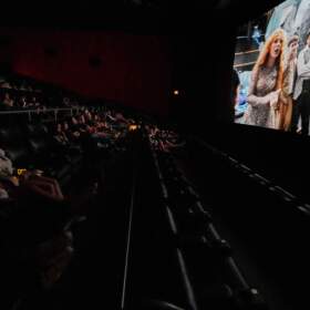 Fans watch a release party film for Taylor Swift's new album "The Life of a Showgirl" at a movie theater Friday, Oct. 3, 2025, in Nashville, Tenn. (George Walker IV/AP)