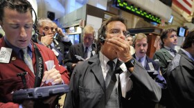 Traders work on the New York Stock Exchange floor, Monday Oct. 6, 2008. Wall Street tumbled again Monday, joining a sell-off around the world as fears grew that the financial crisis will cascade through economies globally despite bailout efforts by the U.S. and other governments. (AP Photo/Richard Drew)