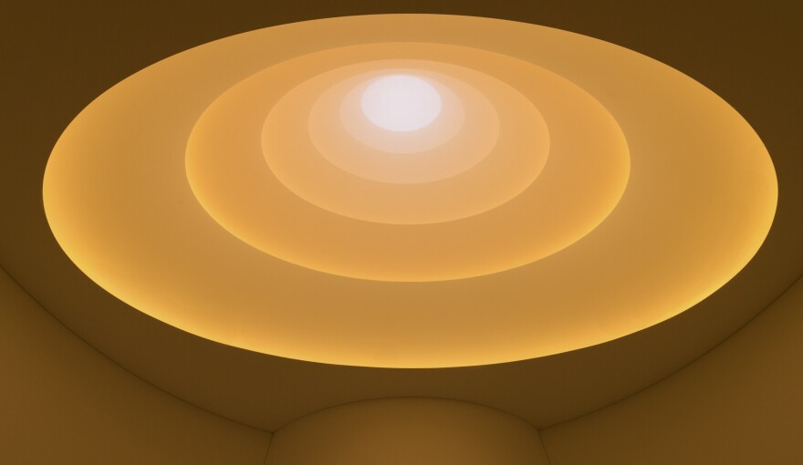 In <em>Aten Reign</em>, Turrell uses natural daylight and artificial LED light to create an immersive experience of illumination and color in the rotunda of the Guggehneim, which was designed by Frank Lloyd Wright.