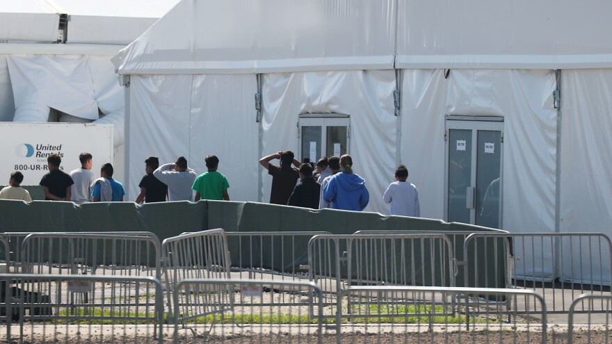 Roughly 130 shelters across the country are housing thousands of migrant children who arrived without their parents or were separated at the border. Children are seen here as they walk through the Homestead Temporary Shelter for Unaccompanied Migrant Children facility in Florida.