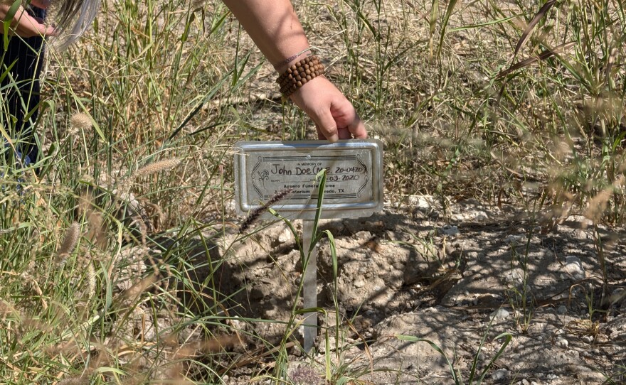 A marker gets placed in memory of an unidentified immigrant who died while attempting to cross the Rio Grande.
