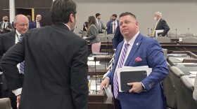 North Carolina state Rep. Jason Saine, R-Lincoln, at right, speaks with Rep. Terence Everitt, D-Wake, after a House Commerce Committee at the Legislative Office Building on Tuesday, March, 21, 2023, in Raleigh, N.C. Sports gambling in North Carolina soared over a major hurdle on the track to its ultimate authorization on Tuesday, March 28, as the House voted for legislation to permit, regulate and tax wagering activities less than a year after the chamber scuttled a similar effort. Saine is a chief sponsor of a sports gambling measure that received initial approval in the state House on Tuesday. (AP Photo/Gary D. Robertson, File)
